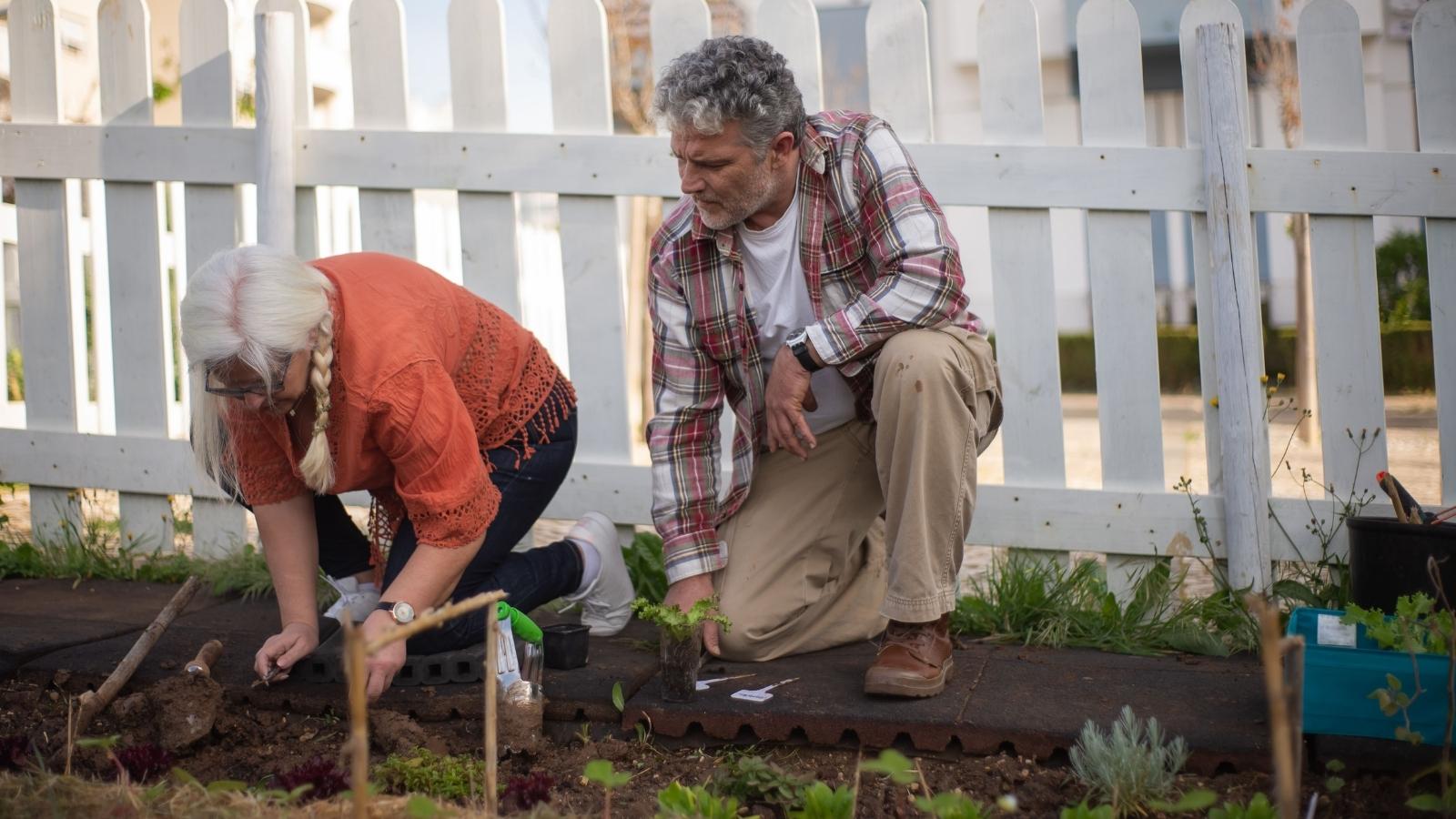 Couple working in their private garden