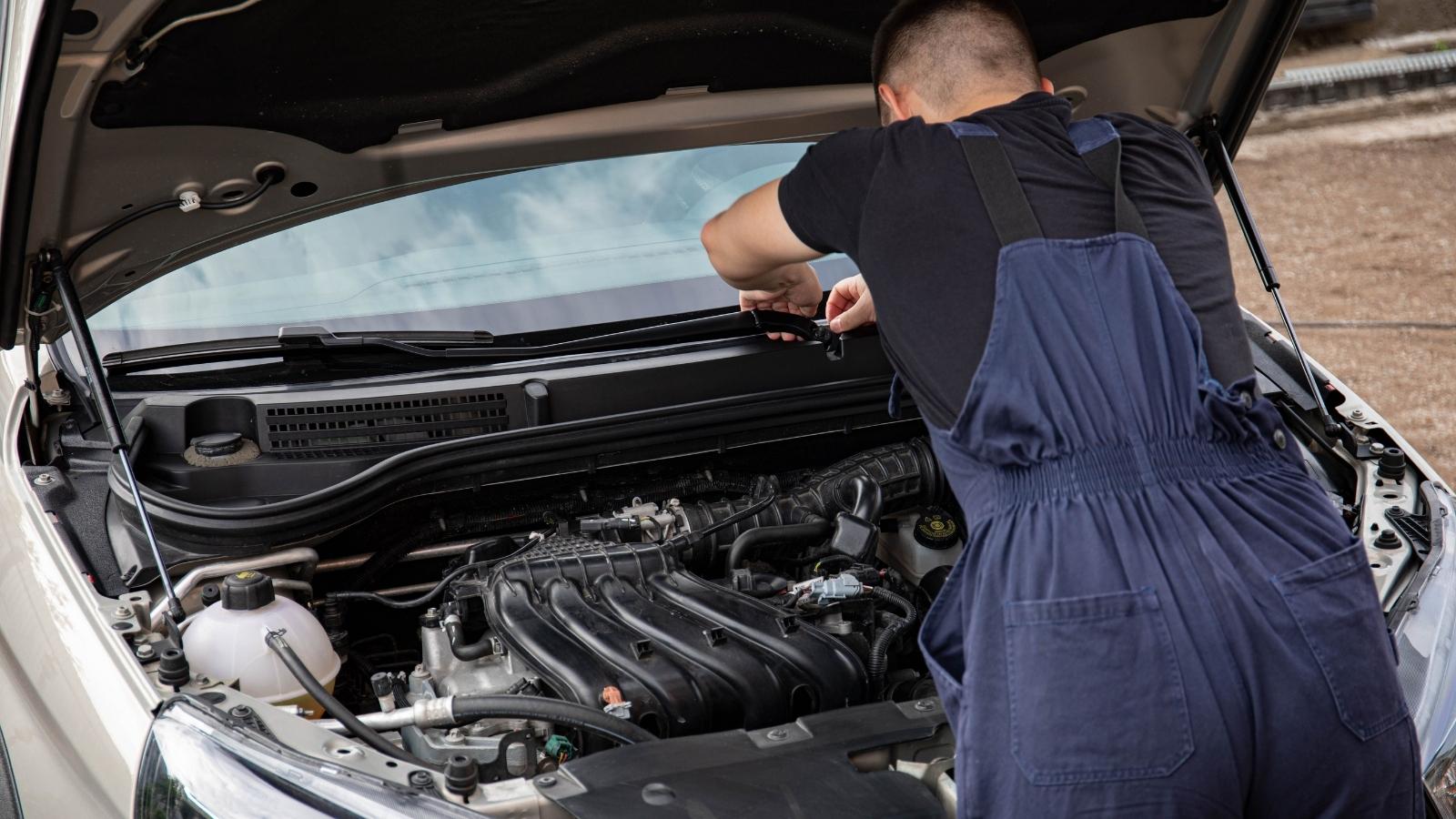 Man working on his Honda Civic at home