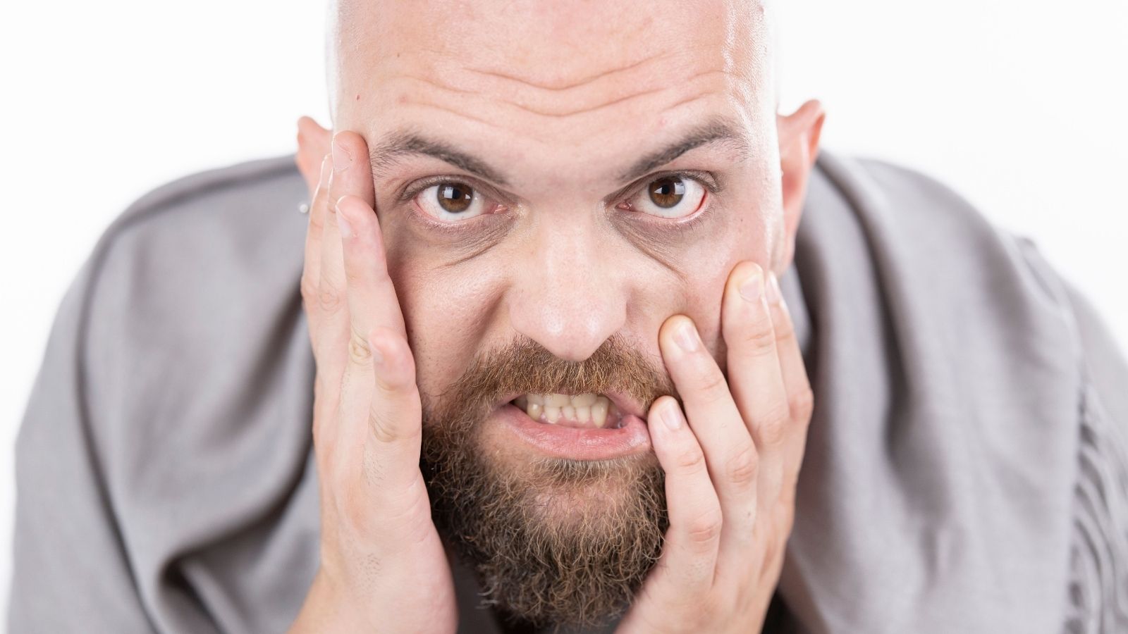 Hes Miserable Even When Hes Not Working, Yet He Cant Afford To Give Up His Jobs Pay And Benefits Man holding his face in frustration