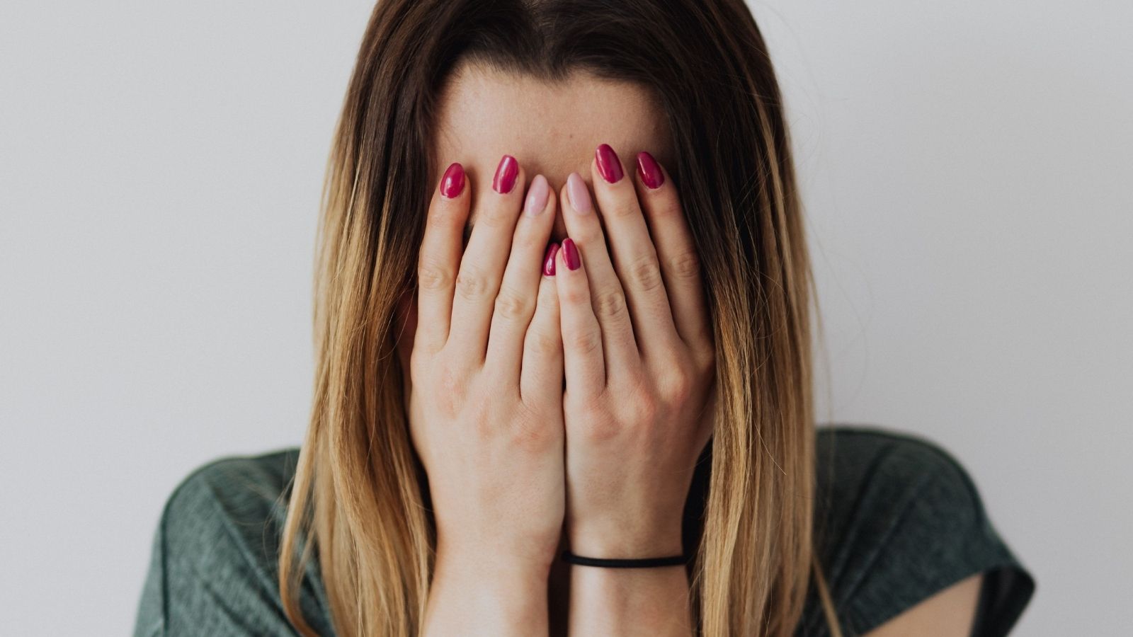 She Meant to Ask How Is Your Day Going? and What Is Your Name?—Then Accidental Word Salad Made Her Ask a Stunned Customer What Are You? Woman covering her face out of embarrassment