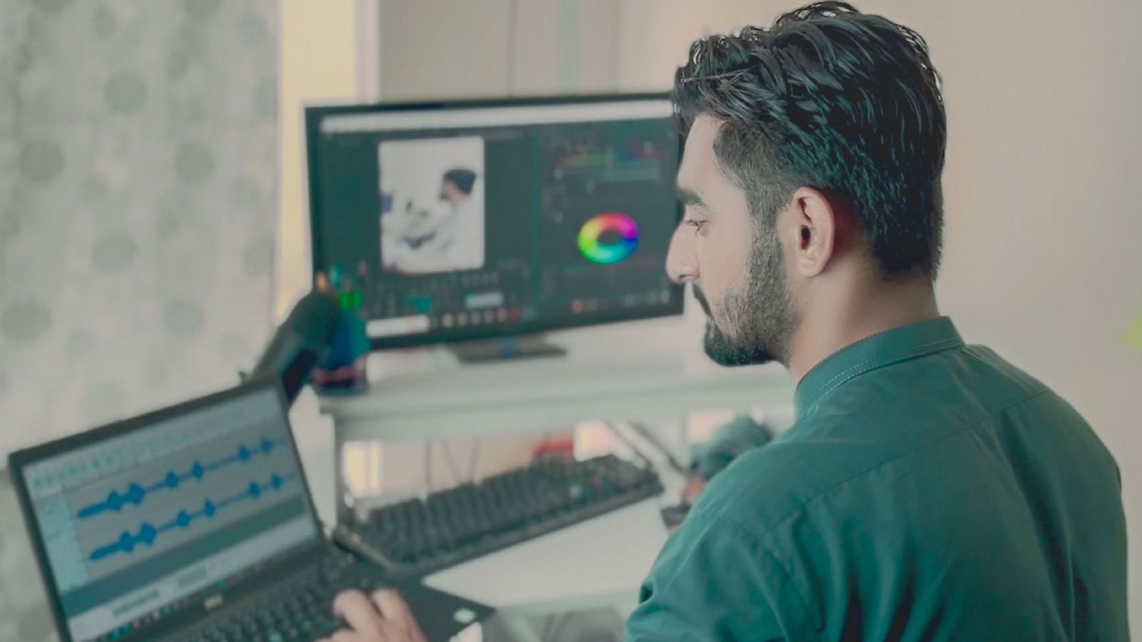 He Tried to Fix His Coworkers Monitors That Kept Going Black — His Manager Insisted the Graphics Card Just Couldnt Handle It Man working on his two screens