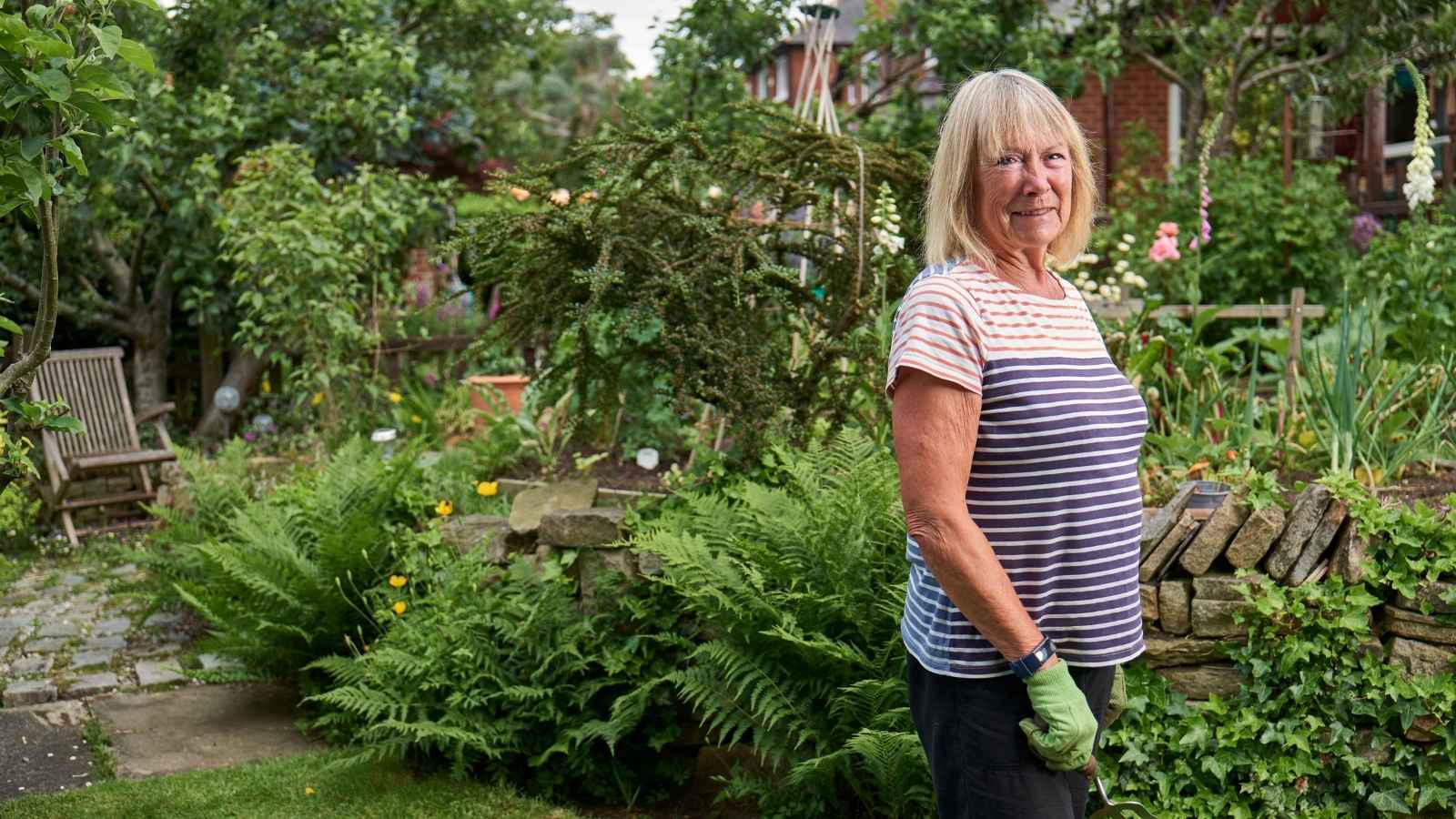 Homeowners Neighbor Broke Their Fence And Came Onto Her Property, Making An Already Bad Conflict Even Worse Woman standing in her backyard
