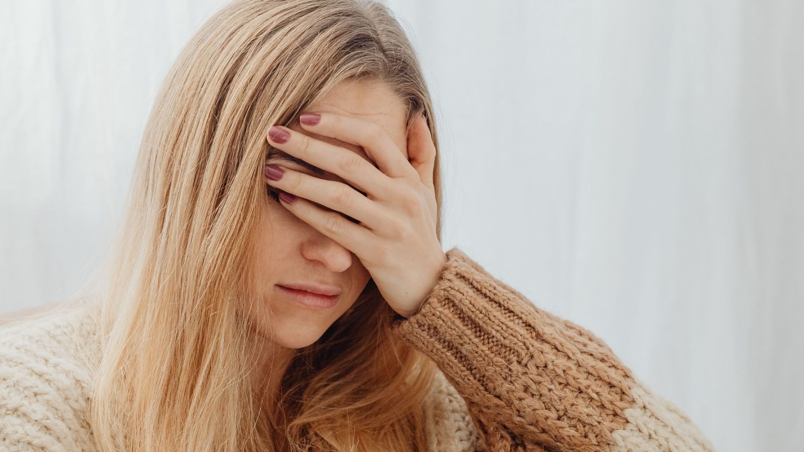 She Covered the Entire $380 Electric Bill After Her Roommate Ghosted for Three Weeks—Now She’s Counting Down the Days to Lease Exit Woman holding her head because she's stressed over roommate