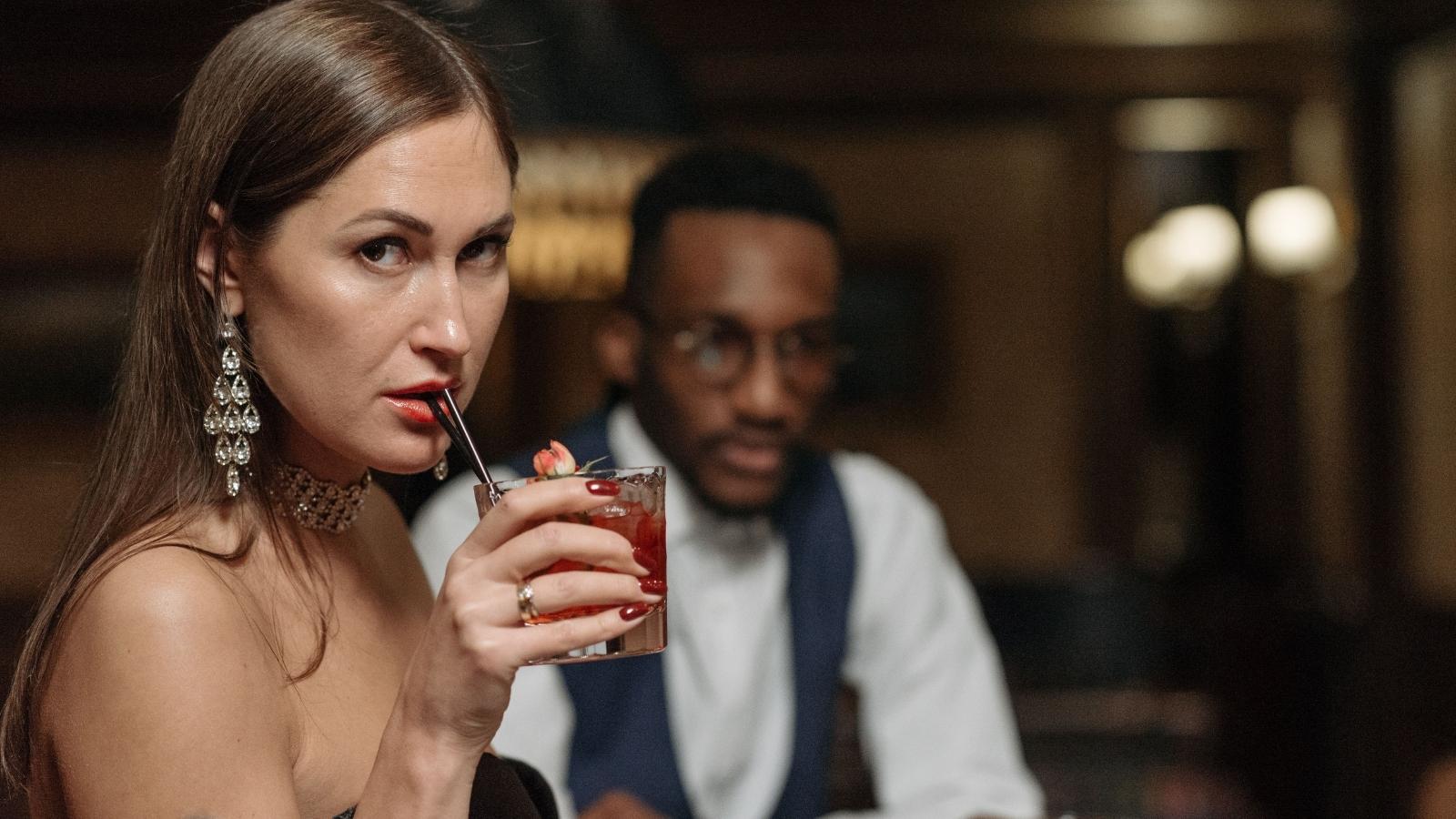 Woman drinking at a bar