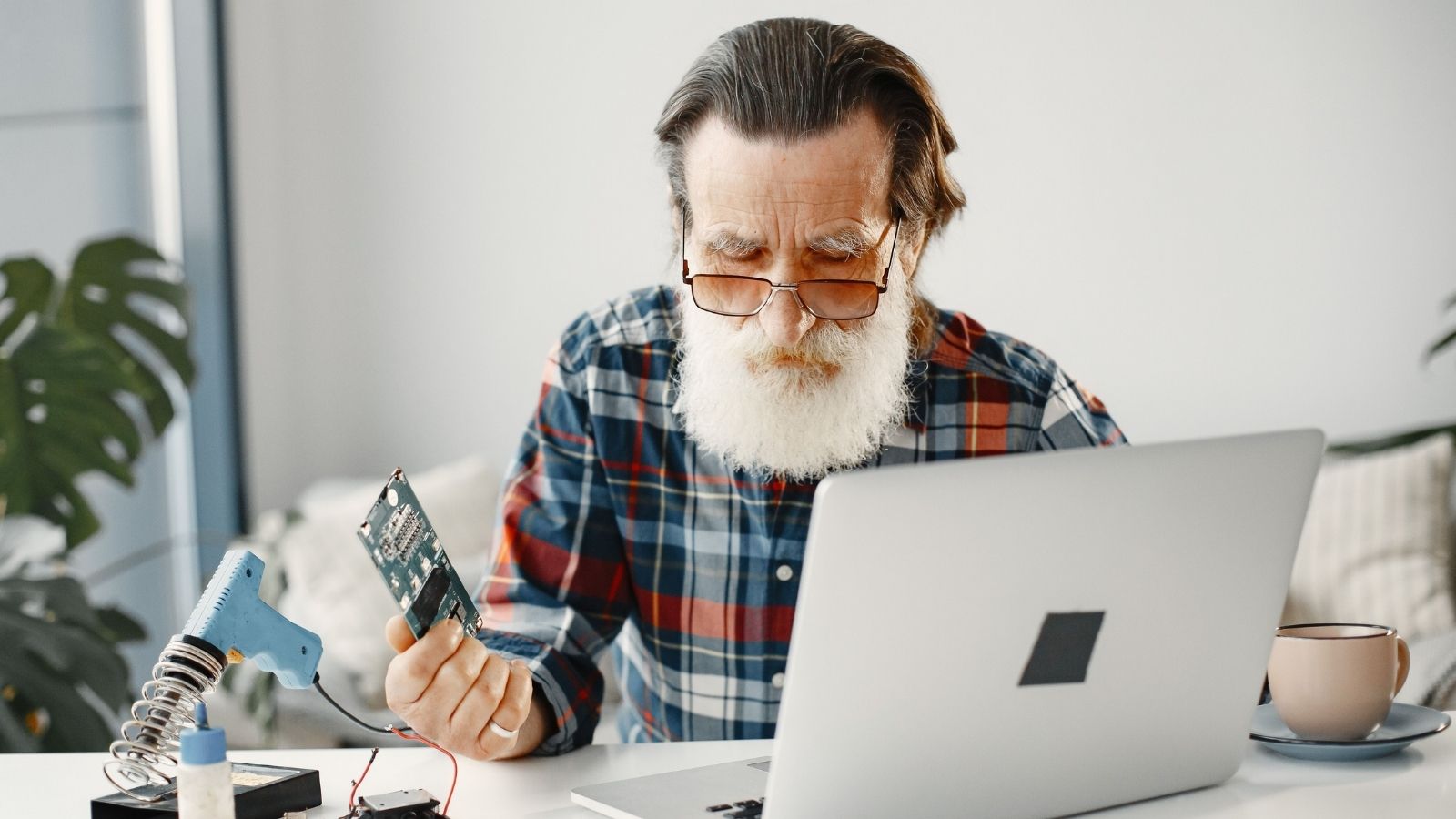 Computer repair guy fixing a laptop
