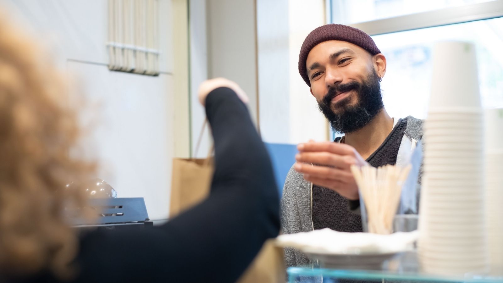 Man picking up a to-to order for he and his wife