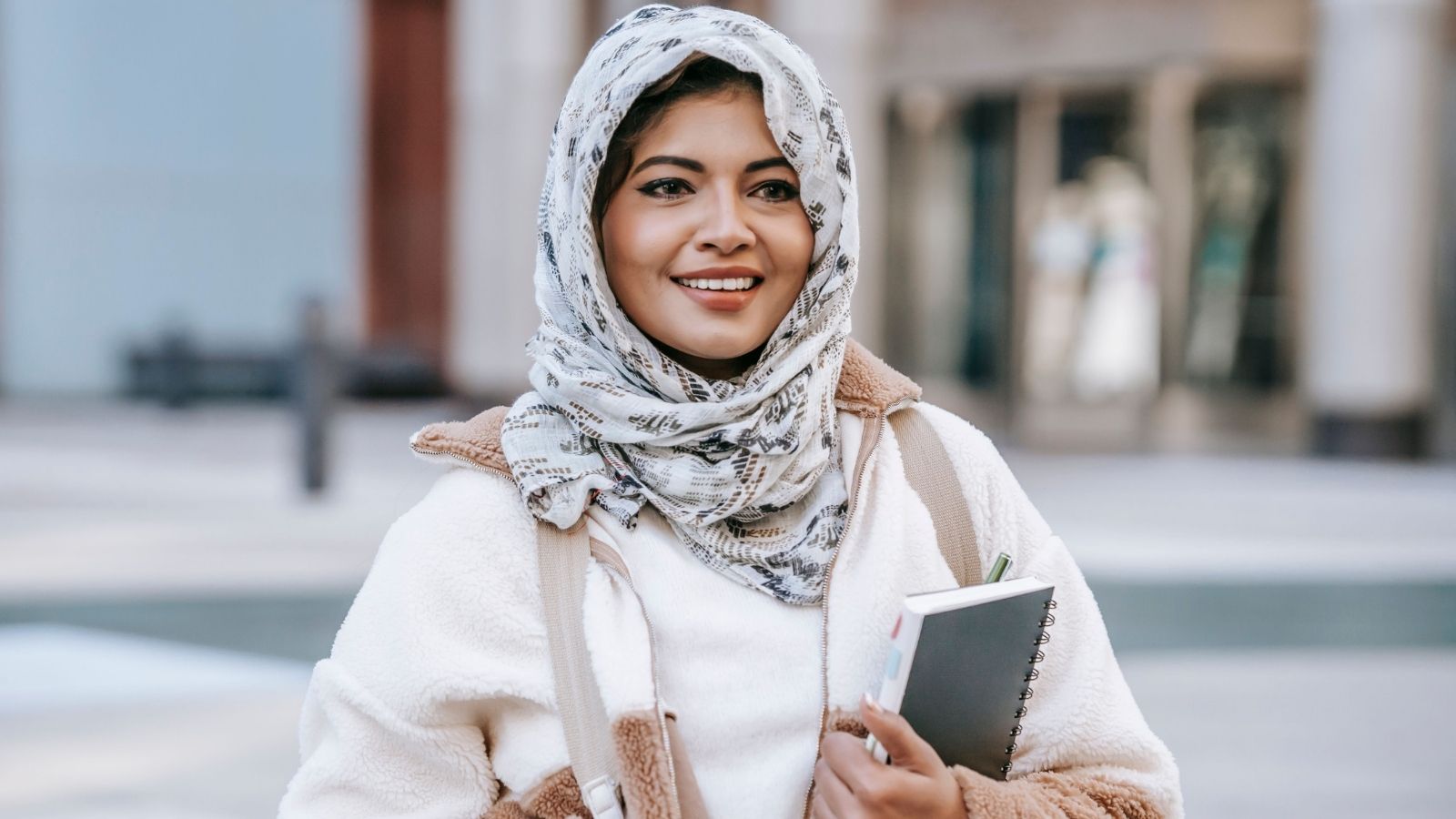 Muslim woman on her way to a college class