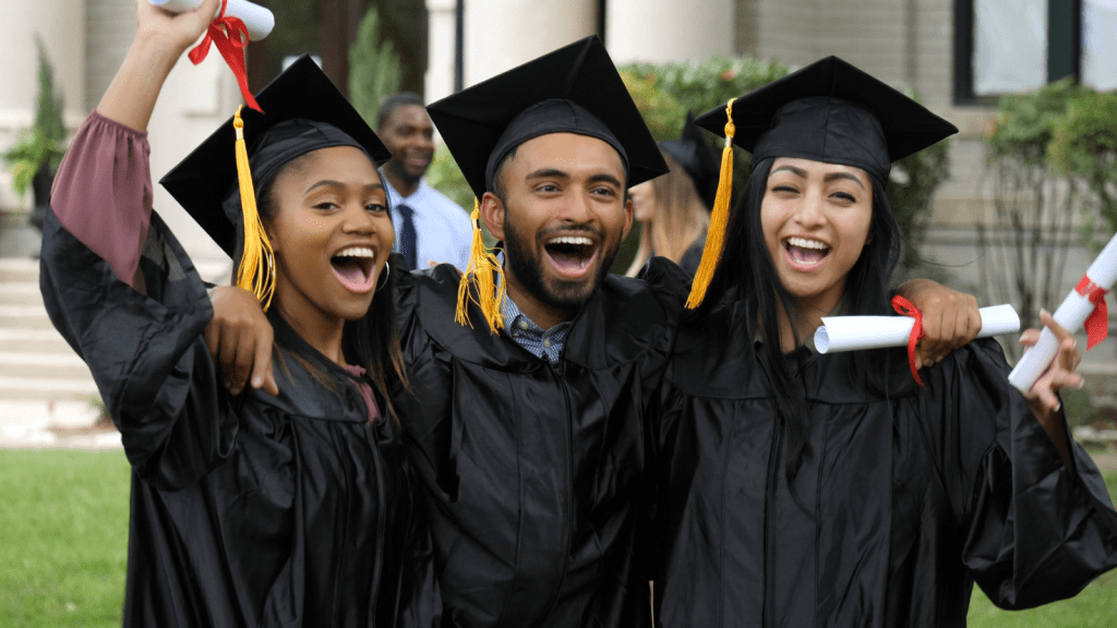 Three friends celebrating their college graduation