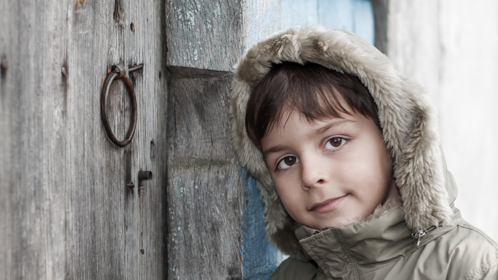 Couple Calls CPS On Awful Neighbors Several Times, But When The Child Finally Gets Taken Away, It Changes His Moms Life little boy standing outside a door
