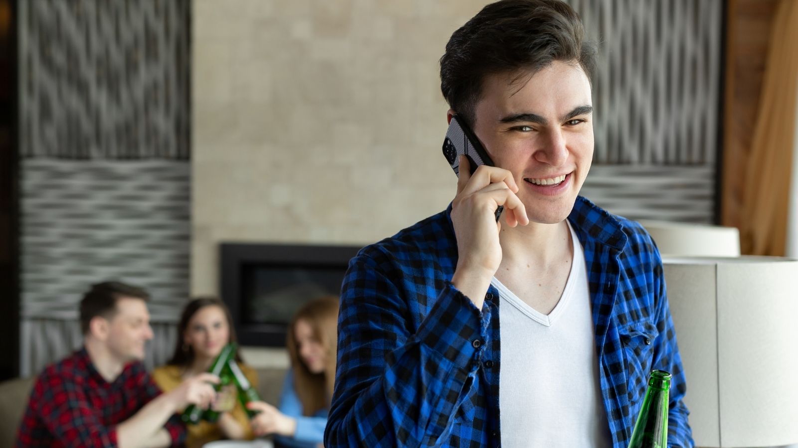 young man on the phone during a party