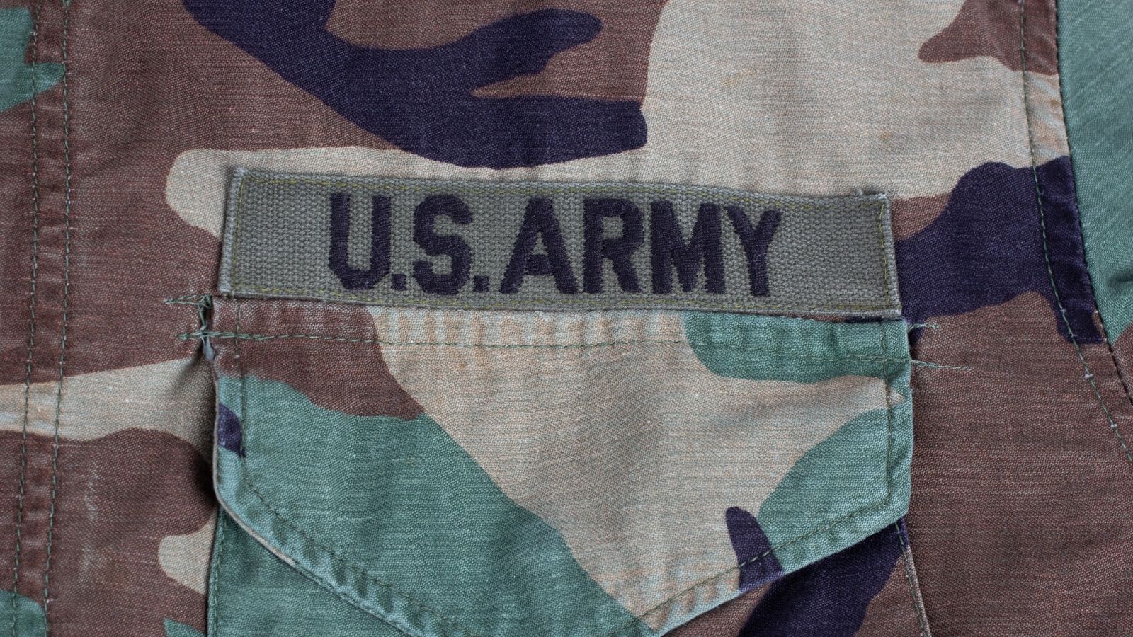 US Army patch on camouflage uniform