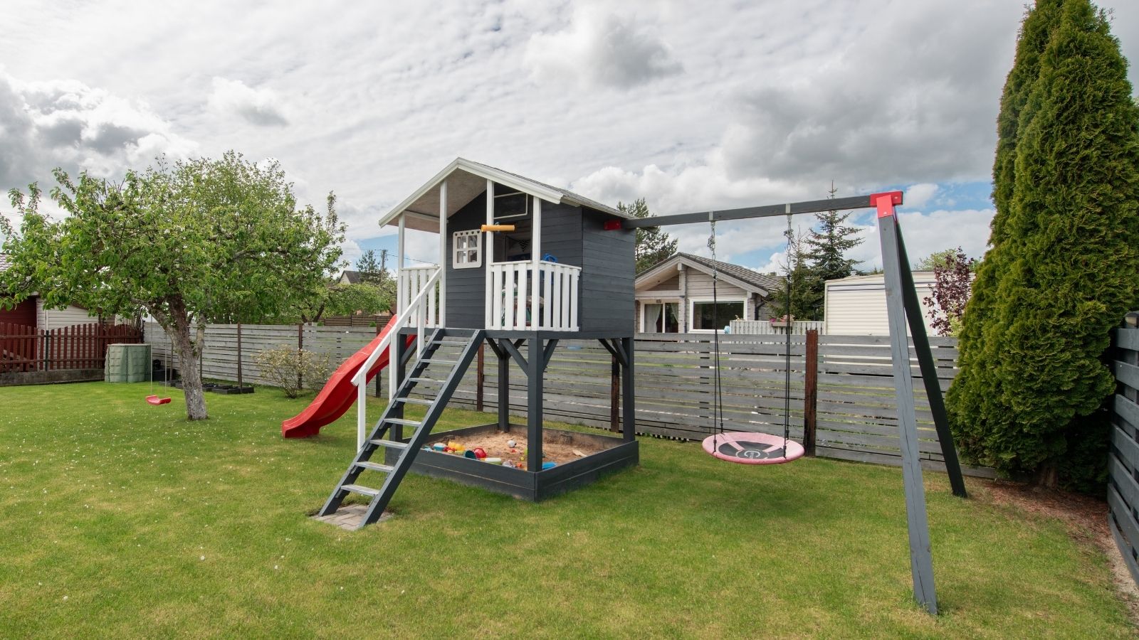 Family Put Playground Equipment In Their Yard, But Their Neighbors Think Their Kids Should Be Allowed To Use It playground equipment in backyard