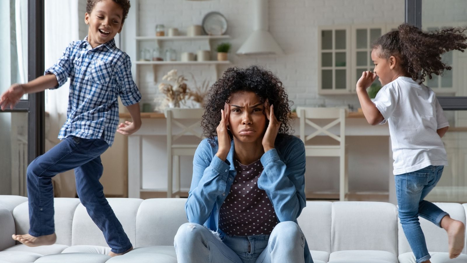 Mom Started Babysitting for Extra Money — Her Daughter Got So Upset About the Mess in Her Room, She Left for Her Dads young woman looking upset while two kids run around