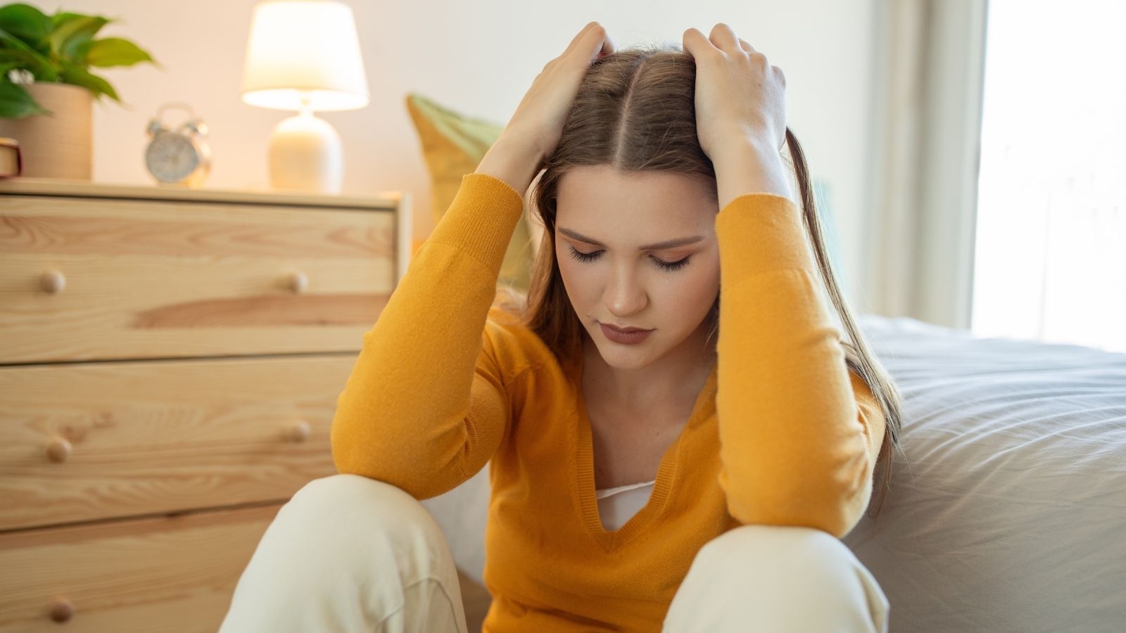 Her Dad Asked For Her Social Security Number — She Refused To Give It Until He Explained Why upset teenage girl in her bedroom