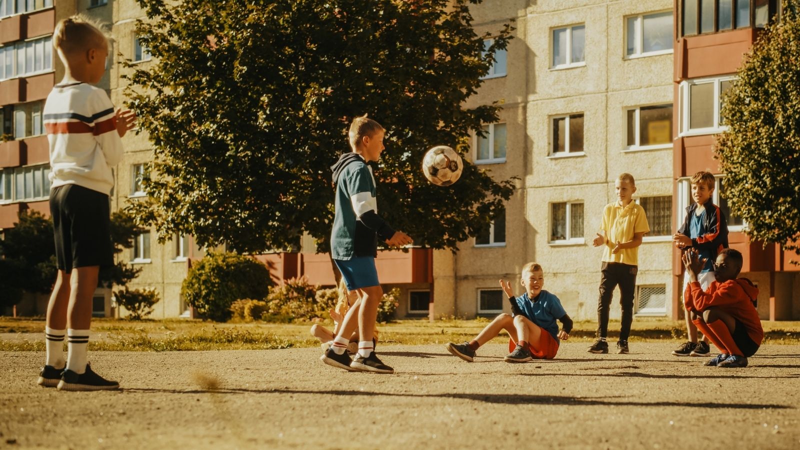 She Encouraged Her Younger Brother To Play With The Neighborhood Kids — Then Found Out They Were Being Mean To Him kids playing with a soccer ball
