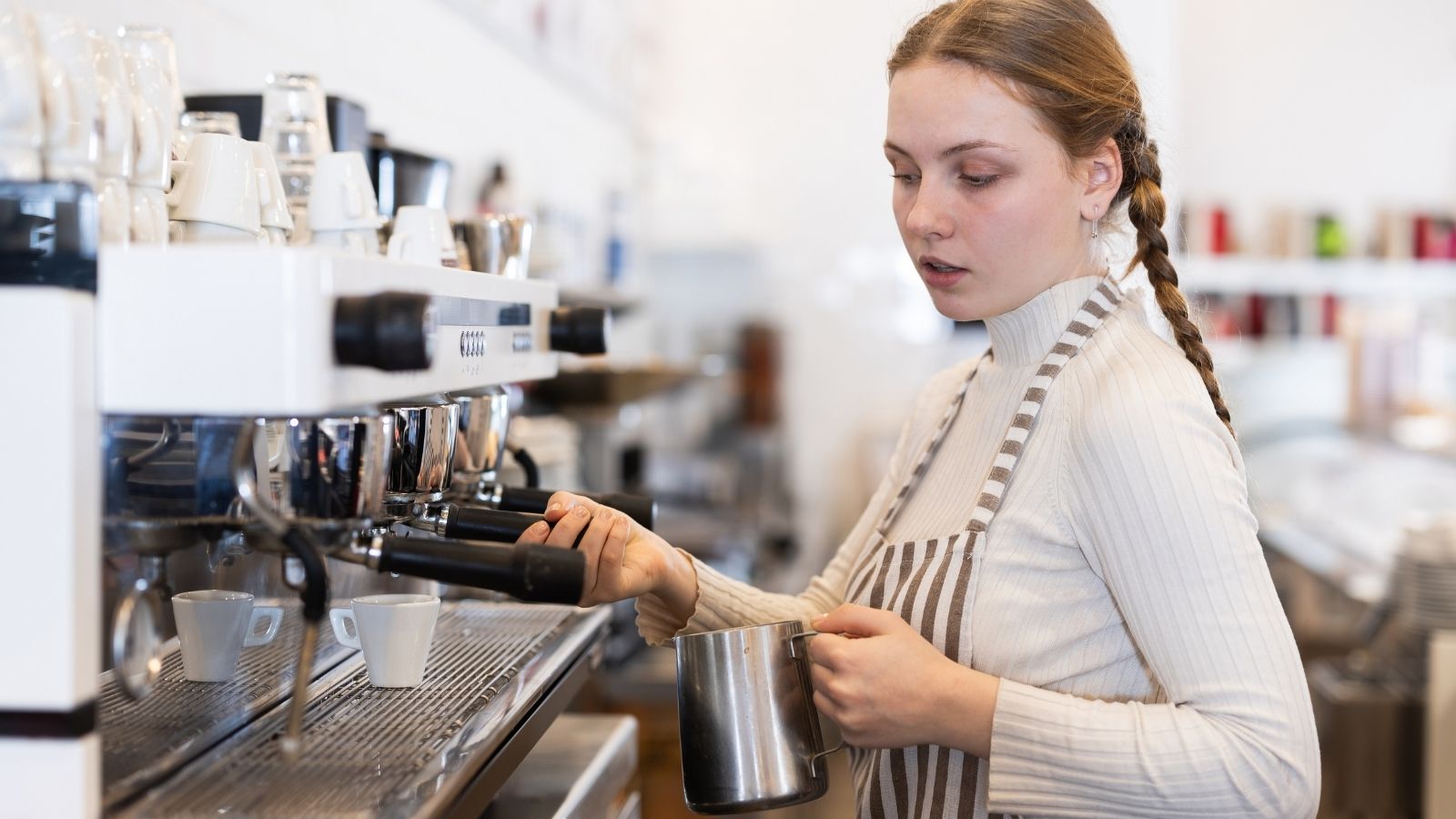 Woman Is Disappointed By Her New Jobs Pay, But Her Dad Thinks Shes Overreacting young woman making coffee at a coffee shop