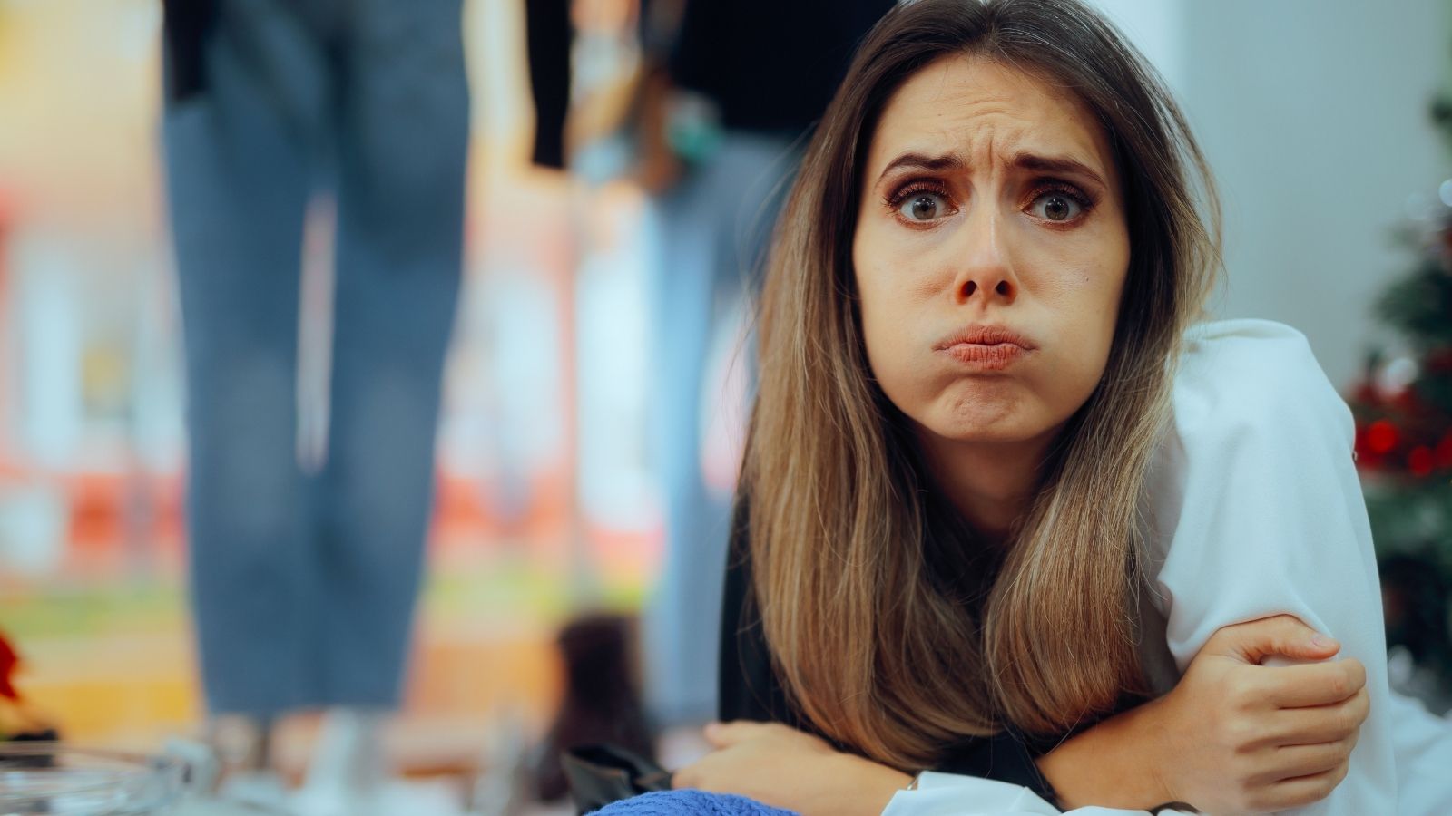 She Used Her Employee Discount To Buy $90,000 In Gift Cards — Corporate Says She Can Resell Them For Profit frustrated employee at a clothing store