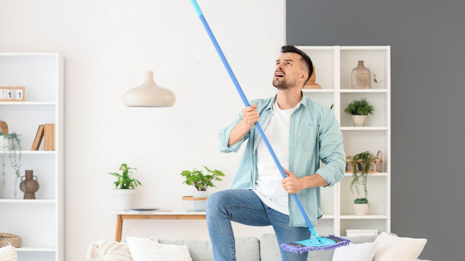 A Neighbor Complained About Noise From A Mother And Daughters Apartment — But They Werent Doing What He Thought man banging on ceiling with a broom
