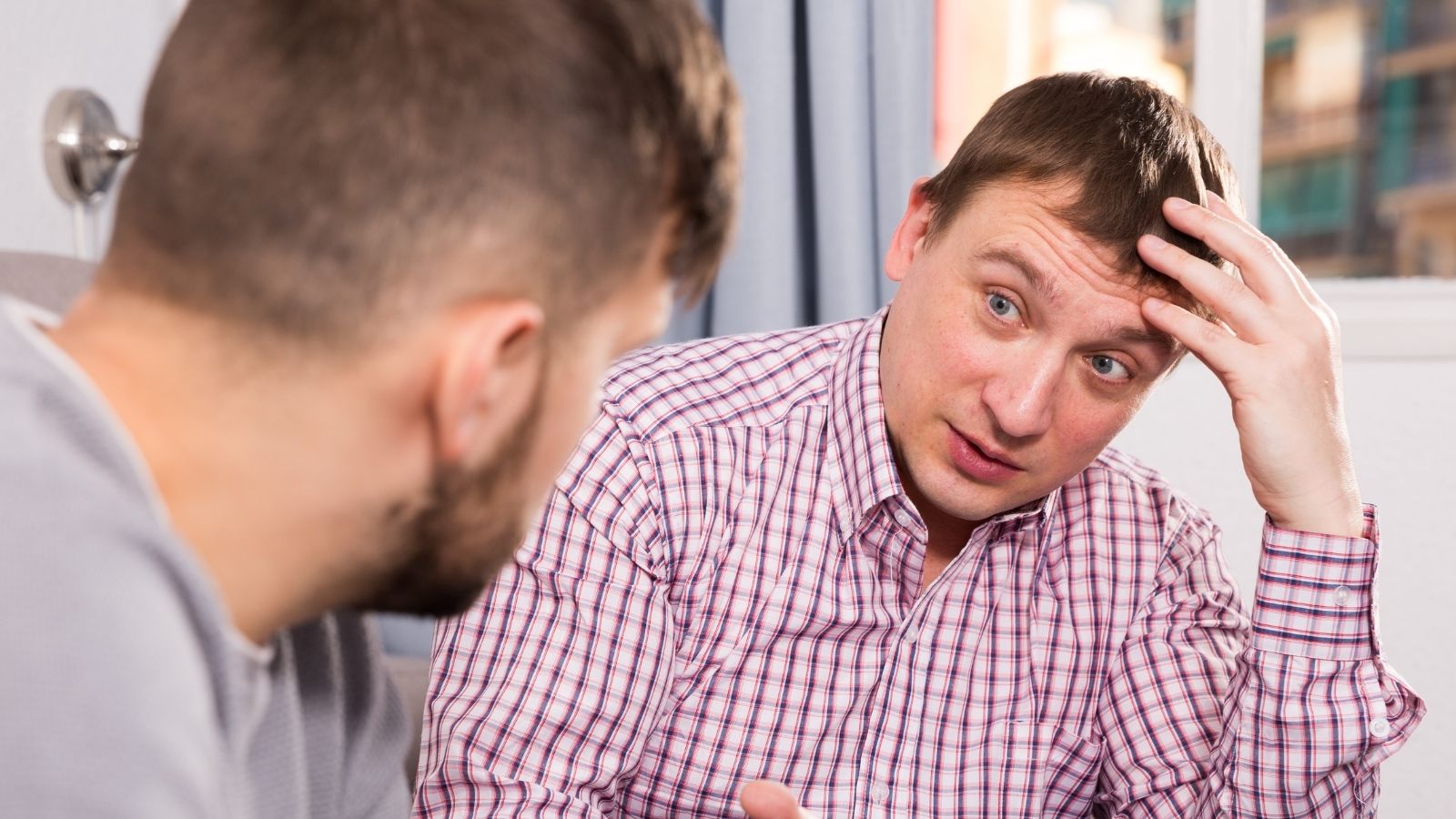 He Did His Friend A Favor — Then Was Annoyed By How His Friend Responded When He Needed Cash For A Ride Home two men having a serious conversation