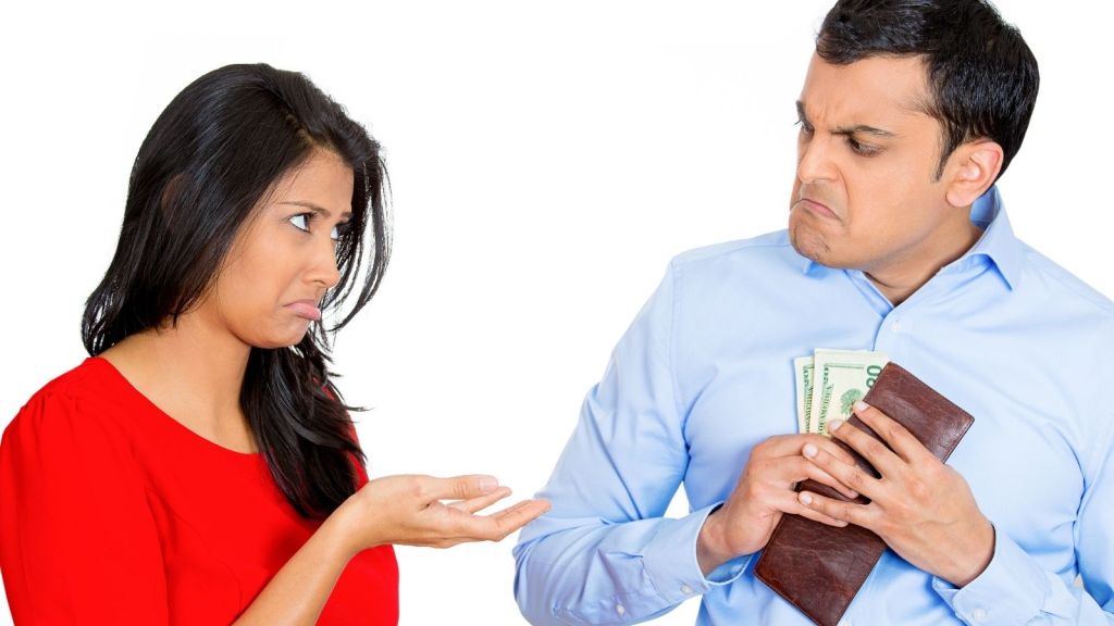 woman holding out her hand for man's money