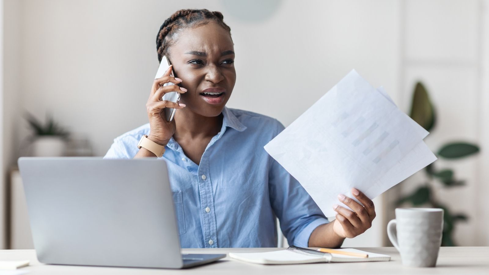 upset businesswoman on the phone