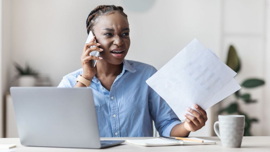 upset businesswoman on the phone