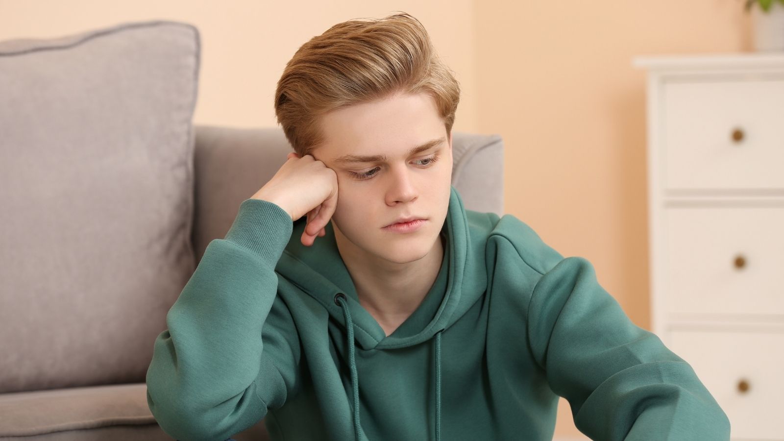His Late Fathers Family Gave Him A Lot Of Money — Now His Mom And Stepdad Want Him To Hand It Over sad teenage boy in his room