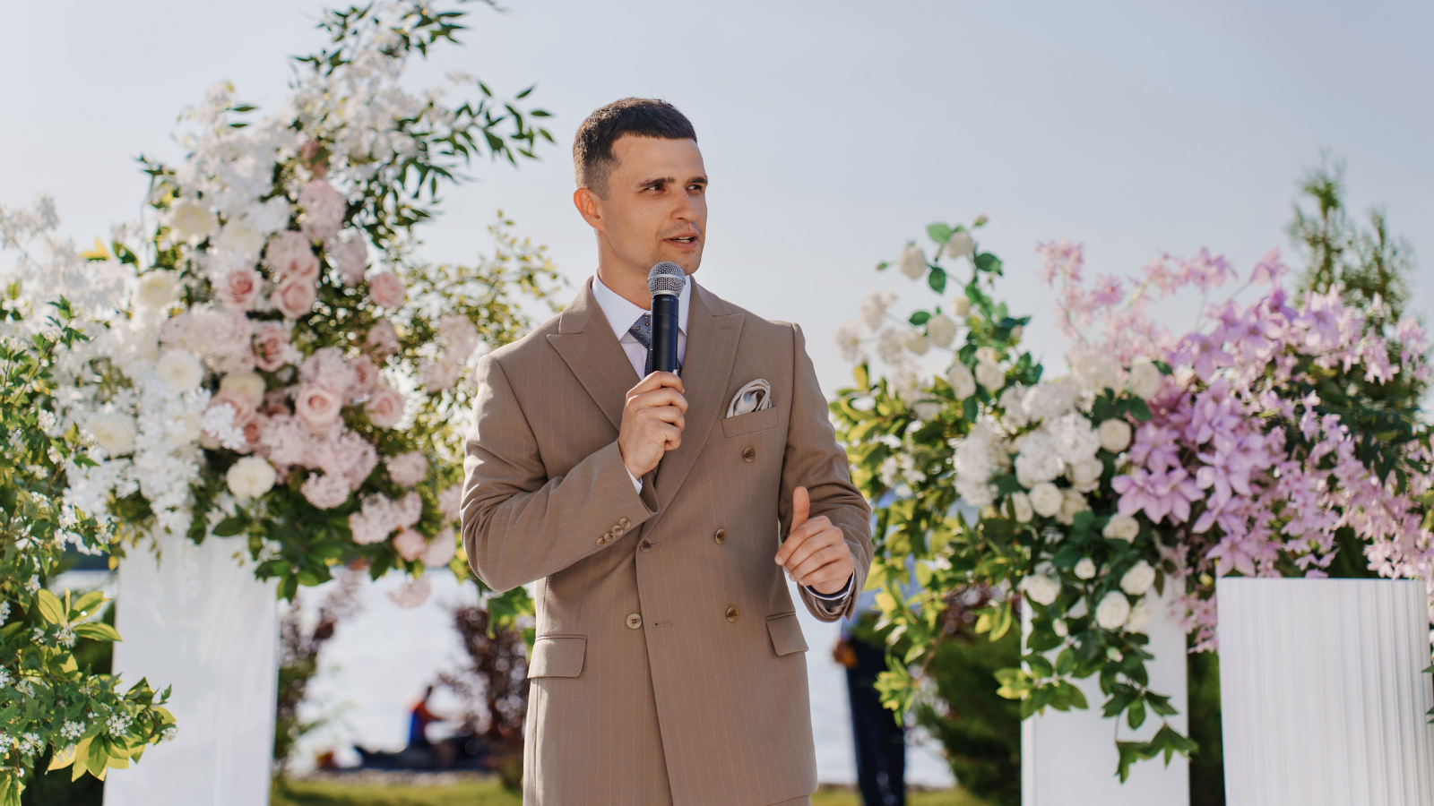 man giving a speech at a wedding