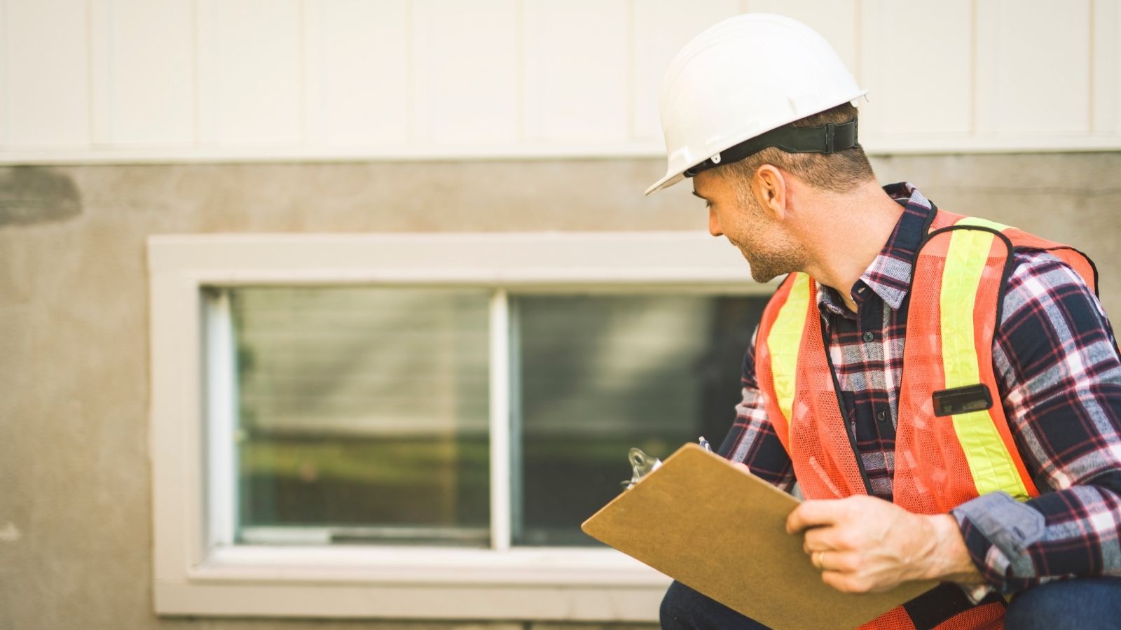 The Board Paid $45,000 in Member Dues for a Structural Audit—Then Stamped it Confidential When Spasms of Wall Cracks Appeared man in a hardhat looking at a residential building