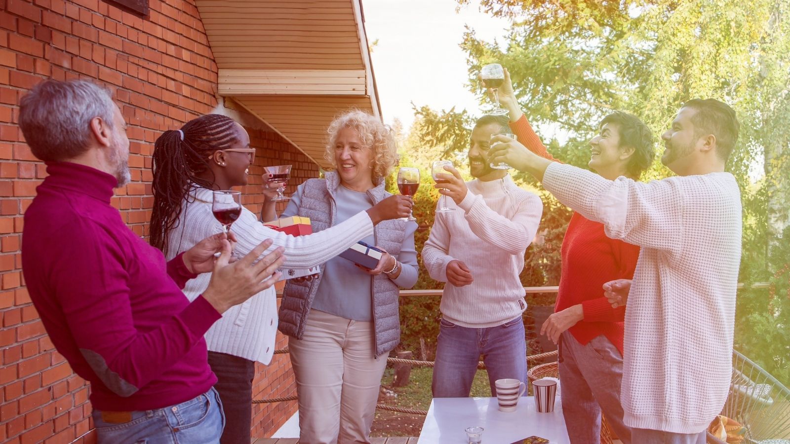 An Overbearing Management Company Pushed an HOA Too Far—So the Entire Neighborhood Banded Together to Bring Them Down happy neighbors toasting their success