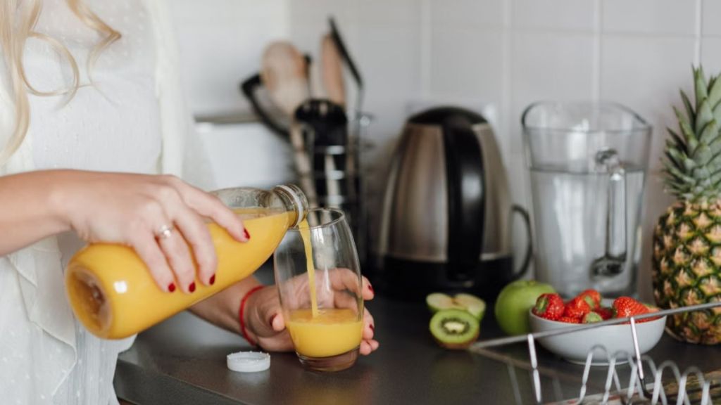 Woman pouring juice into a glass