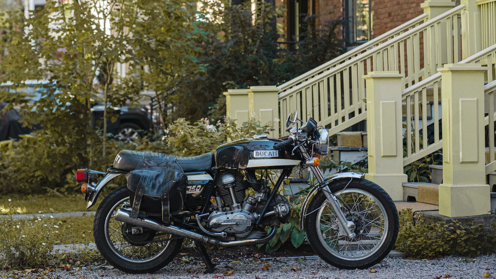 His Neighbor Keeps Using His Driveway — Talking to Them About the Boundary Has Gone Nowhere Motocycle parked on a driveway near the stairs