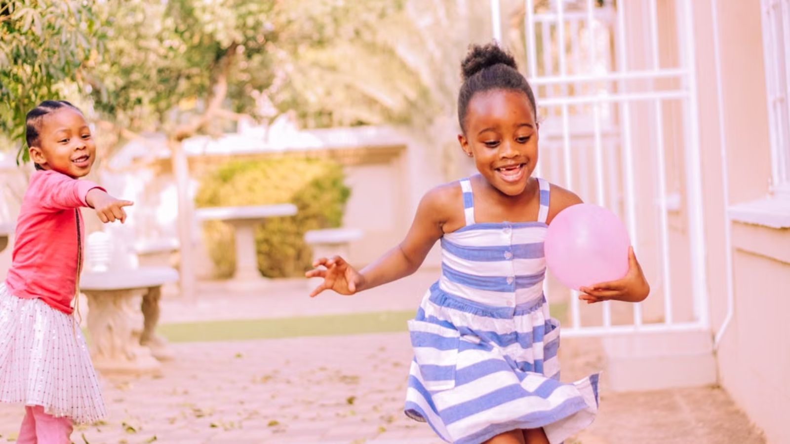 He Endured Loud Screaming in His Backyard for Months—Then Got Confronted by an Angry Parent for Yelling at the Kids Young girls happily playing and running outdoors