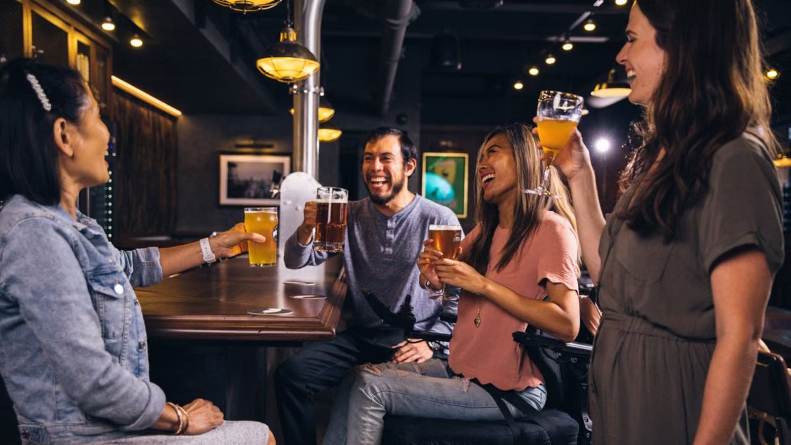 A group of friends happily sharing drinks and conversations