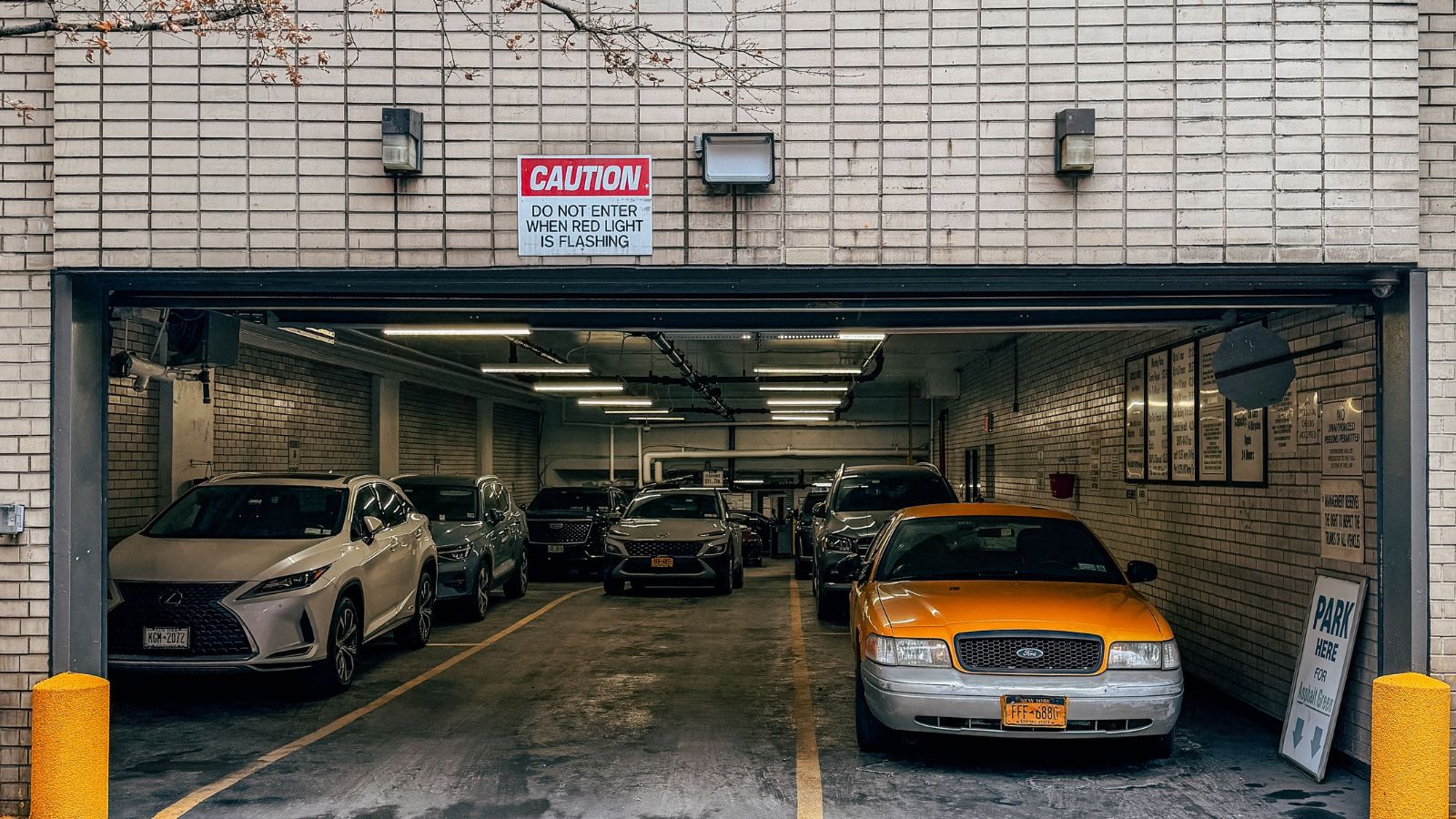 A Strangers Car Took His Spot. The Owner Was Nowhere to Be Found for More Than a Day Basement parking garage with cars parked