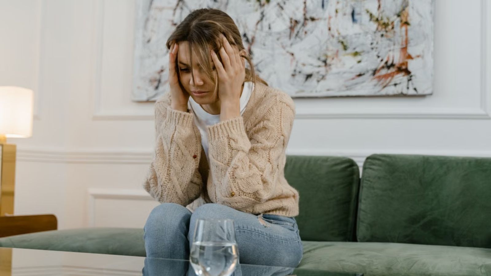 Homeowner Tried Everything to Drown Out Her Neighbor’s Noise—Now She’s Considering Further Action Woman feeling upset at home and covering her ears with her hands