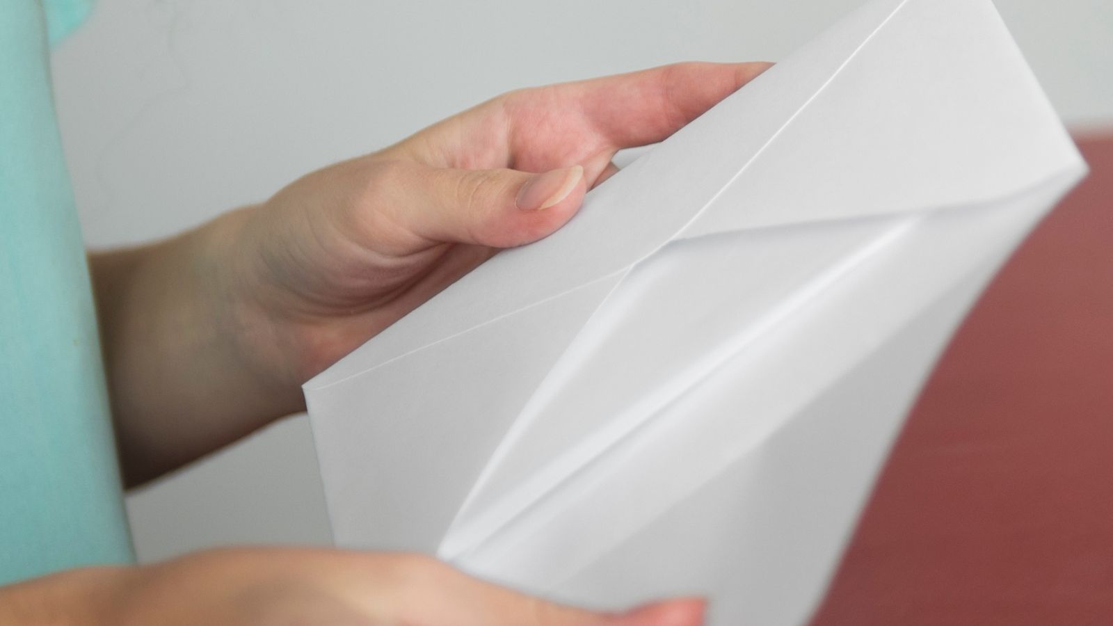 She Got Invited to Her Nieces Wedding Shower — But Felt Like an Afterthought, and Almost Didnt Go Woman opening an envelope