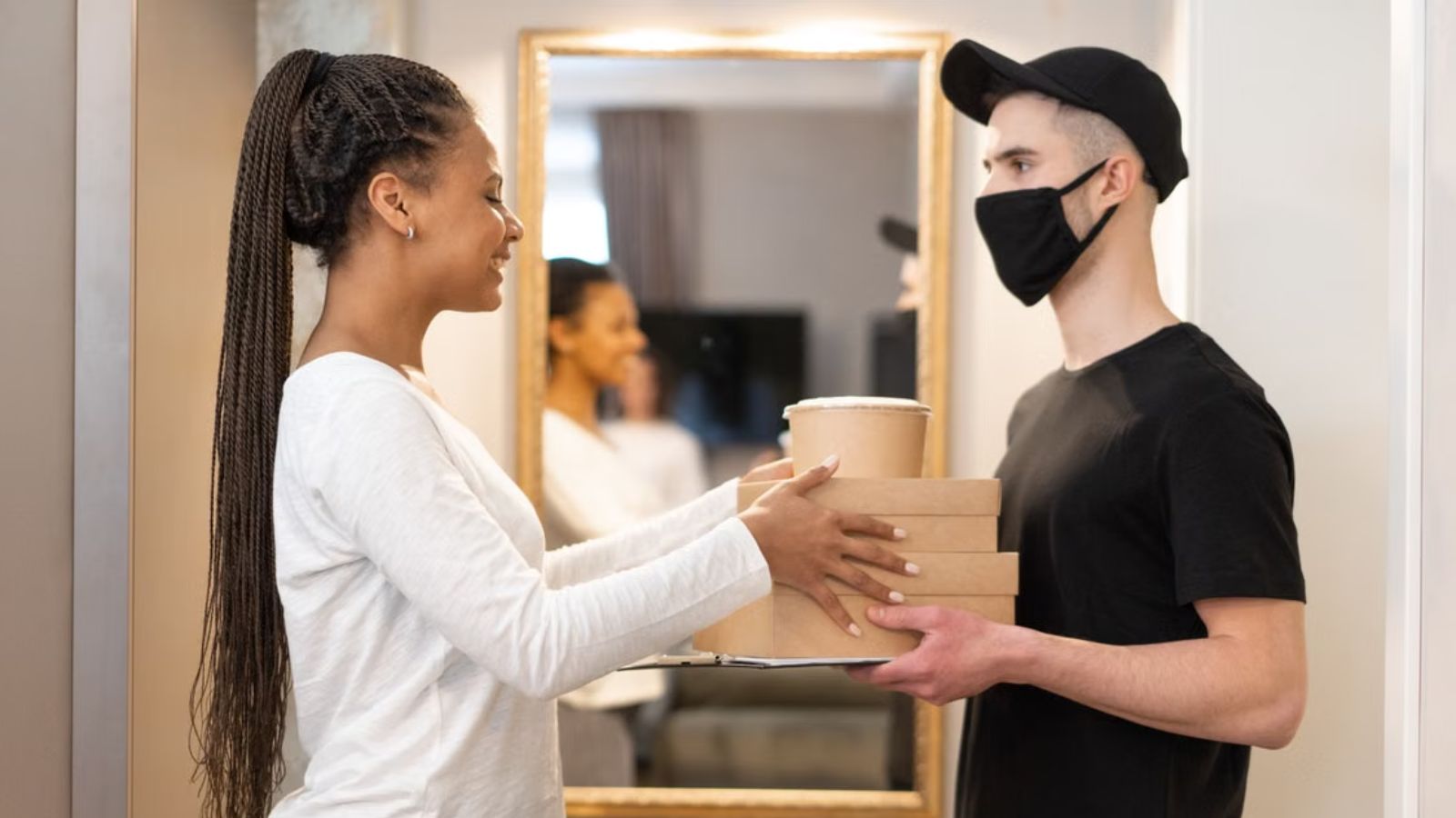 Woman Refused to Share Her Food With Her Niece—Then the Child Cried and Her Partner Called Her Selfish Woman receiving food from a delivery driver