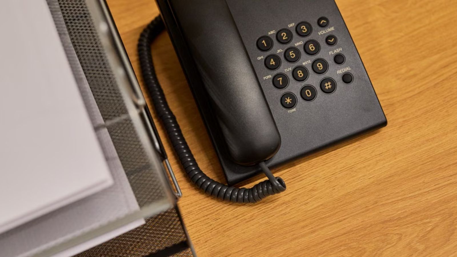 Employee Warned Management About a Phone System Decommission—Then the Problem He Predicted Happened A telephone on a. clean offcice desk