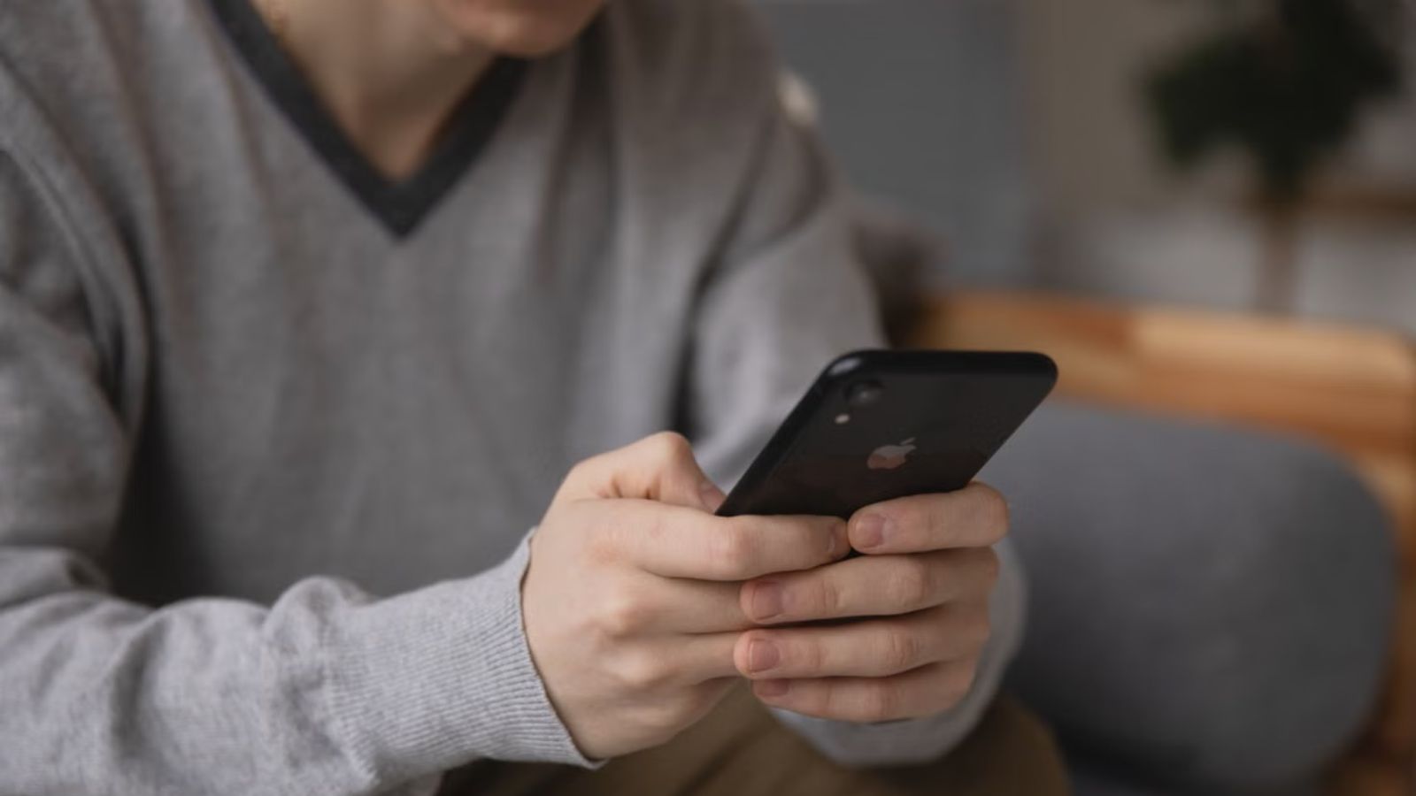Man typing on his phone