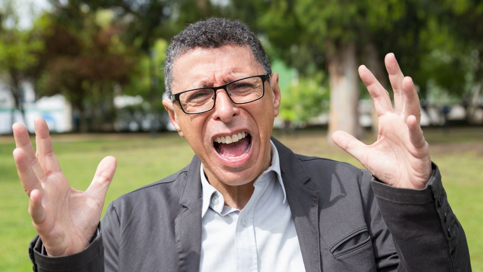 His Guests Were Intimidated and His Driveway Was Blocked Daily—Then He Logged the Ordinance Violations Indignant middle-aged man screaming and raising hands outdoors