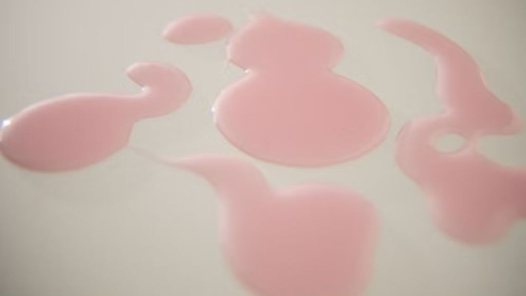 Splats and spills of pink laundry detergent