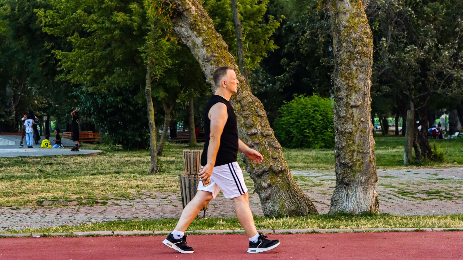 Man walking in a clean and quiet neighborhood