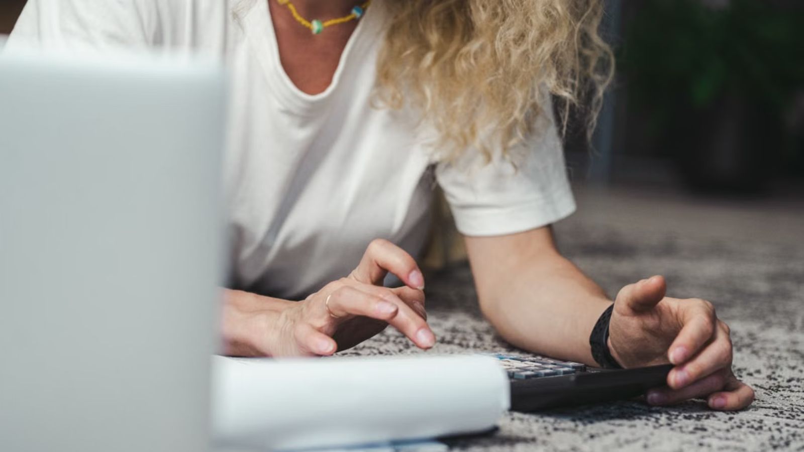 She Calculated the Per Head Costs for Her Best Friends 30th Birthday Trip—Then Got Disinvited After Exposing a $1,200 Surplus Markup Woman computing for expenses using a calculator