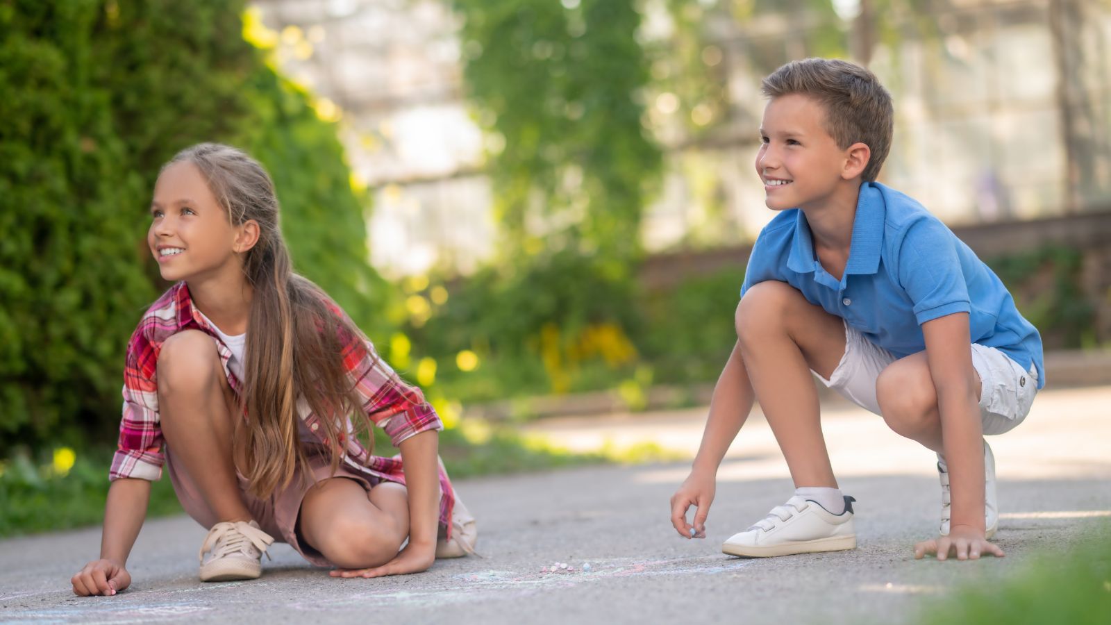 She Asked Her Neighbors to Keep Their Kids Off Her Lawn—Then Installed 4K Security Cameras and Served a Trespass Warning for Property Damage Boy and girl drawing with chalks on the ground