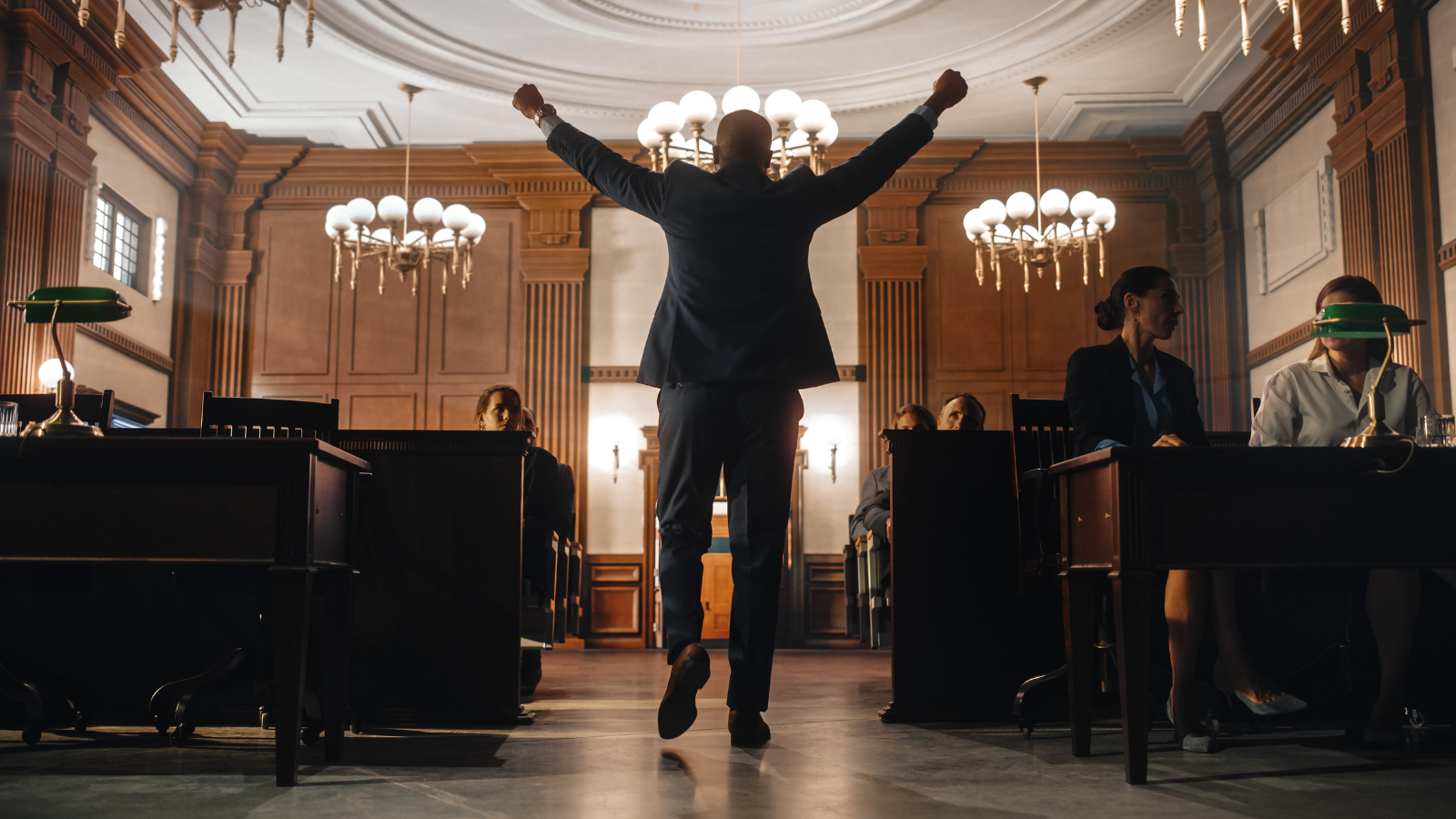 He Condemned the Governor’s Brutal Budget Cuts to Public Defense—Until He Realized the Governor Is a Licensed Attorney Who Knows Exactly What Hes Gutting man in courtroom looking very happy