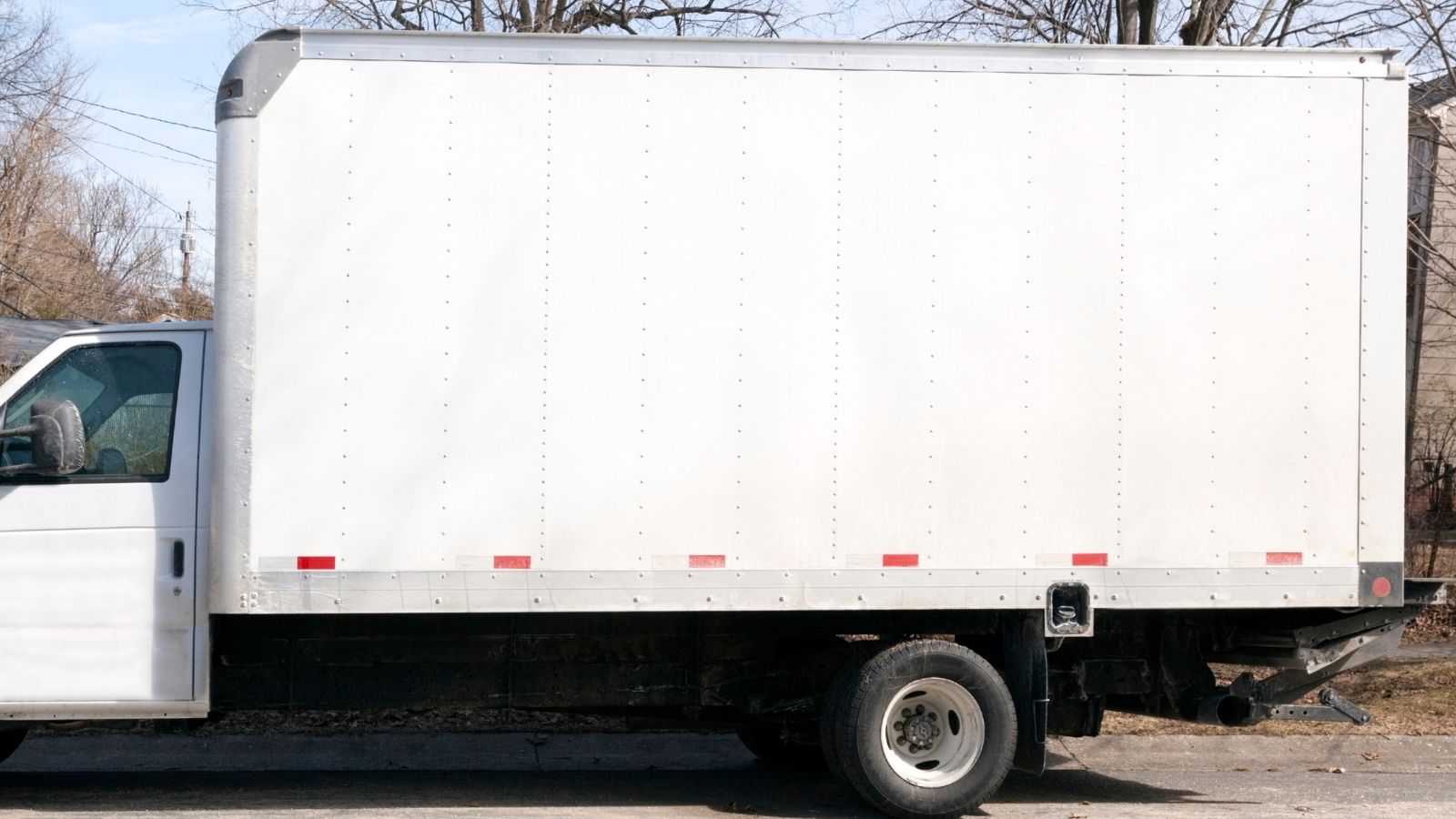 His Neighbors Parked Five Commercial Work Vans on the Residential Street—So He Used Municipal Abandoned Vehicle Ordinances to Clean Up the Block white box truck parked on the street