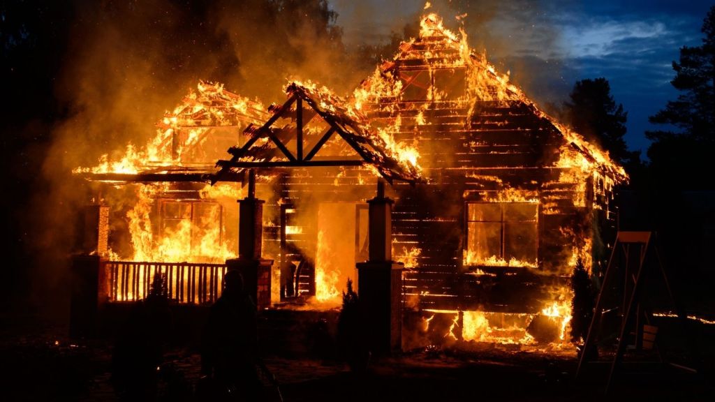 house on fire at night