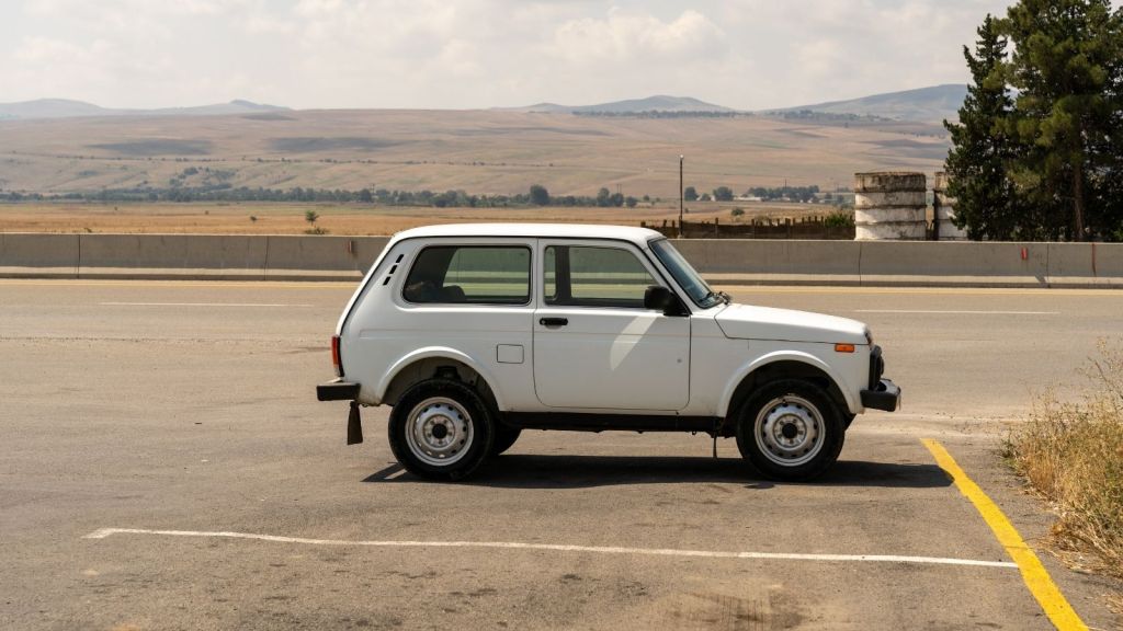 white car parked in a parking lot
