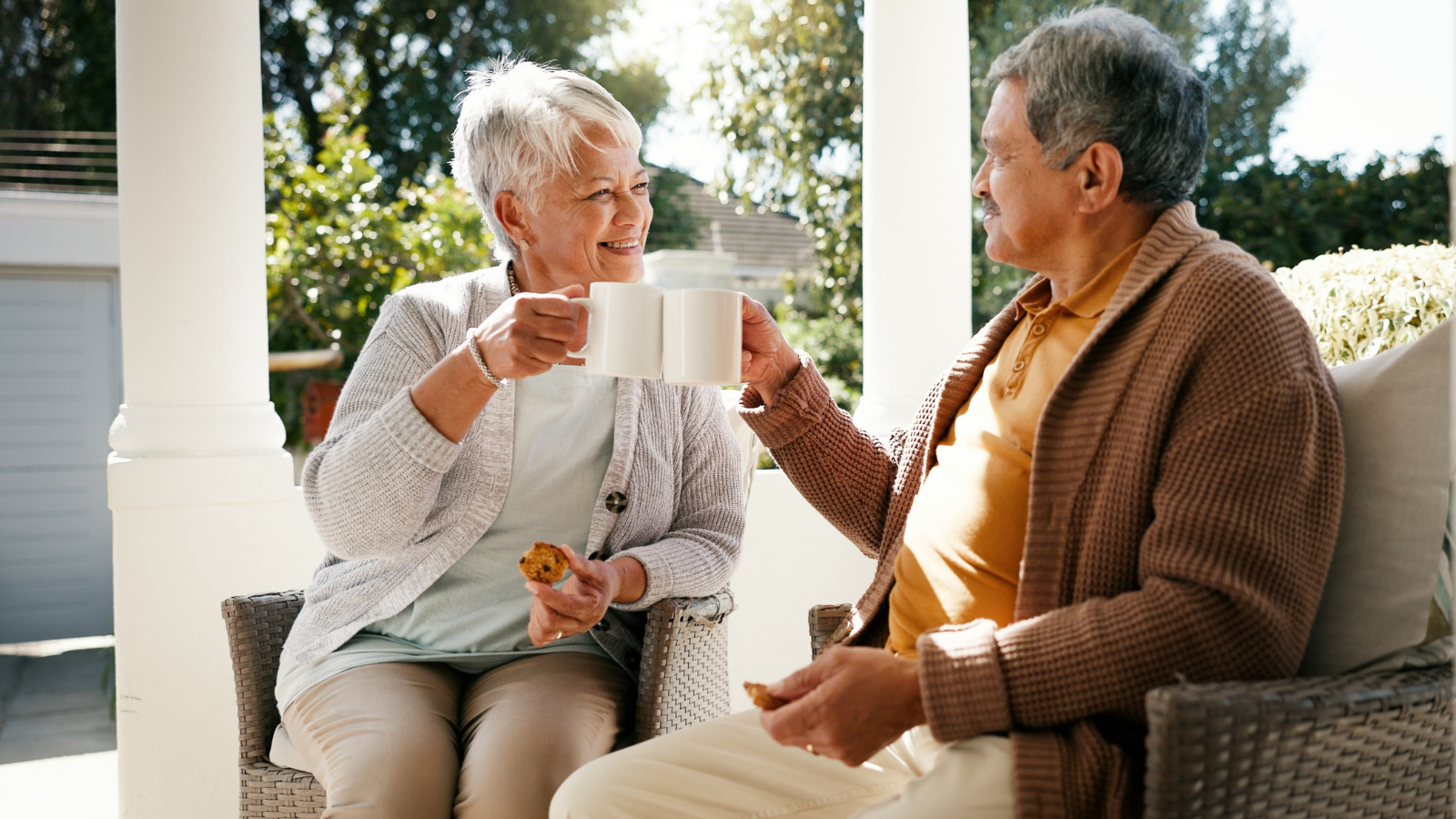 man and woman drinking tea on patio